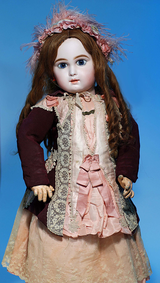 Rare 31-inch 'Incised Depose' bebe Jumeau in original dress. Image courtesy Frasher’s Doll Auctions.