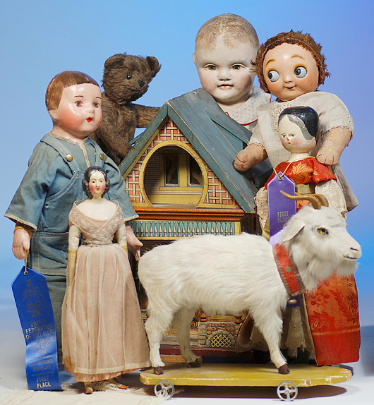 Alabama Baby, Philadelphia Baby, milliner’s model and peg wooden shown with Bliss dollhouse, early teddy bear and pull toy goat. Image courtesy Frasher’s Doll Auctions.   