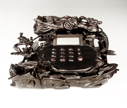 Finely carved zitan telephone with base of openwork carving. Estimate: upward of $15,000. Image courtesy Gianguan Auctions.   