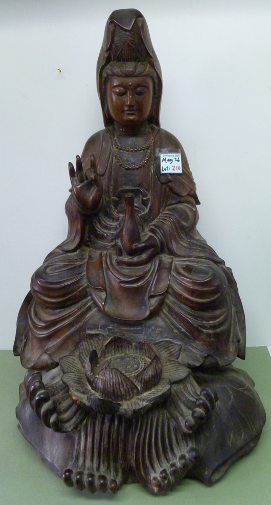 24-inch-tall Guanyin sculpture of Xinjiang walnut wood, likely from the Silk Road, Qing Dynasty, 1760-1840. Asian Antiques & Art Gallery image.   