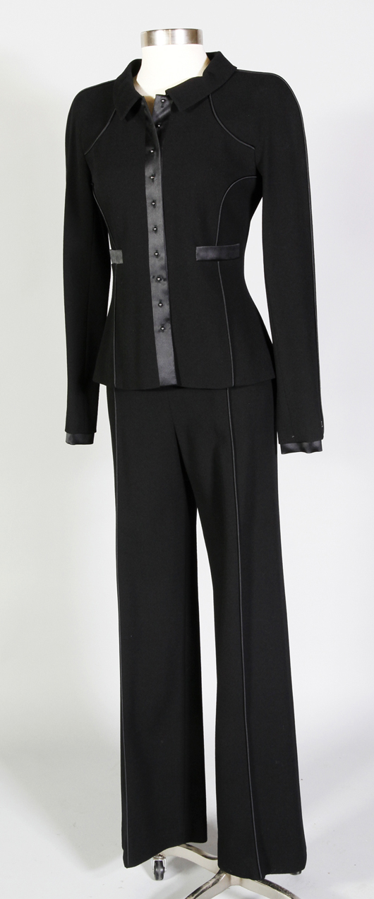Chanel suit, wool, black with pining detail and satin trim, size 2. Worn once. Estimate: $700-$900. Image courtesy Kaminski Auctions.   