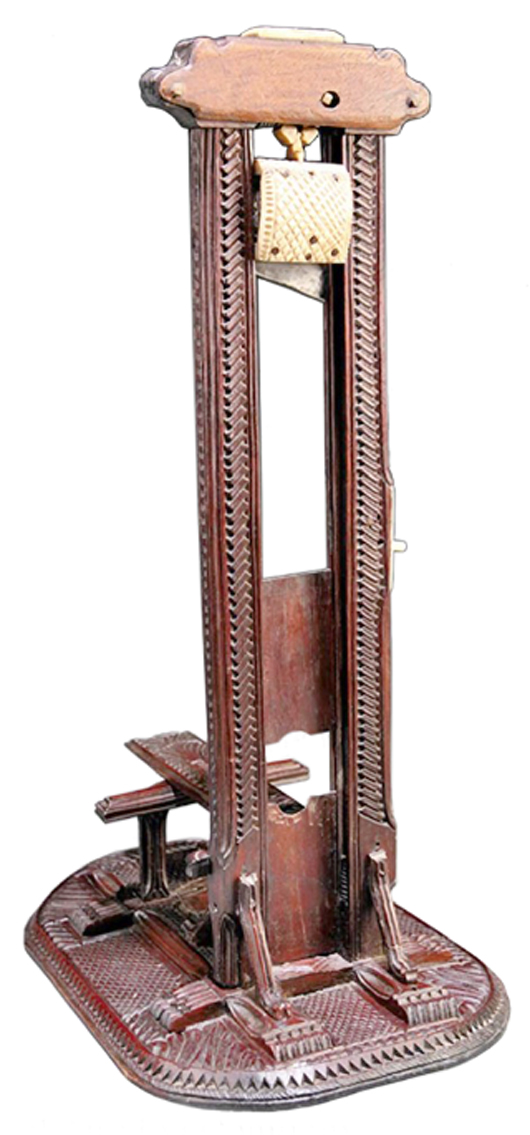 Would your father like this? It's shaped like a guillotine and works like one when cutting off the end of a cigar. It auctioned in November for $1,464 at Neal Auction Co. in New Orleans. It should be kept out of the reach of children.