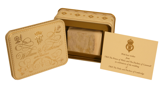 A slice of cake from the wedding of Prince William and Catherine Middleton, in its presentation tin and accompanied by printed wedding ceremony mementos, was auctioned by PFC Auctions on May 24 for £1,917 (approx. $2,970). Image courtesy of PFC Auctions.
