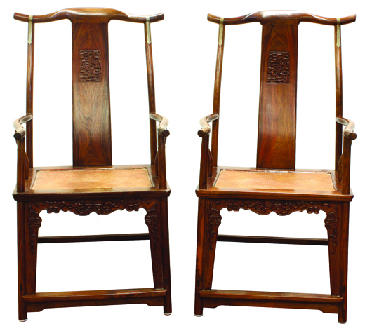 Topping the Asian offerings was this pair of Chinese huanghuali yoke-back chairs, Qing dynasty, which sold for $59,250. Image courtesy Clars Auction Gallery.