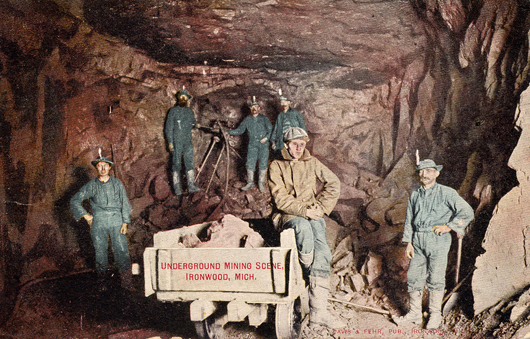  An early 1900s postcard pictures miners in an iron mine in Ironwood, Mich. Image courtesy Wikimedia Commons.