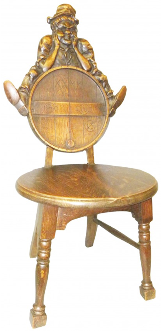 The carved man leaning on the back of this wooden chair must have bumped into the head of a person seated on it. But in spite of the discomfort, the unique humorous design attracted a buyer who paid $885 for the chair at a Showtime auction in Ann Arbor, Mich.