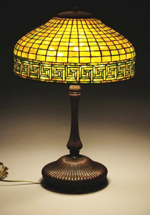 Tiffany Studios leaded-glass lamp in Greek key motif, signed ‘Tiffany Studios New York,’ est. $20,000-$30,000. Morphy Auctions image.