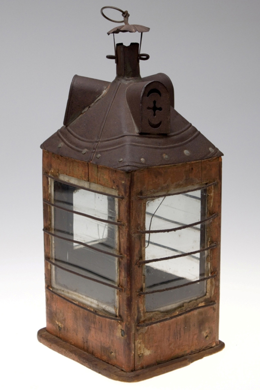 Square softwood frame and glass candle lantern with worn red paint, circa 19th century (April 28 sale, $3,335, Lot 449). Image courtesy Jeffrey S. Evans & Associates.