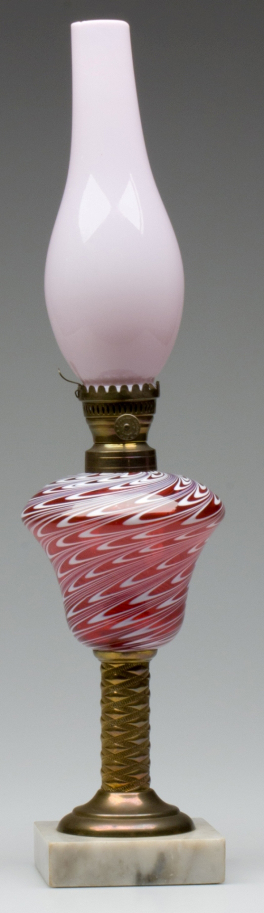 Swirled marbrie loop stand lamp, ruby with opal pulled and swirling loops, marble base (April 28 sale, $2,760, Lot 1). Image courtesy Jeffrey S. Evans & Associates.