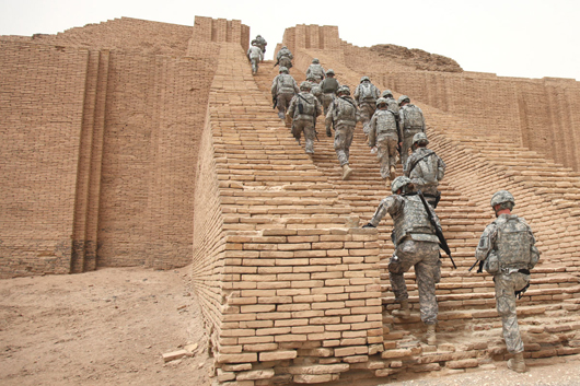 U.S. soldiers climb the reconstructed stairs of the Ziggurat of Ur in Iraq in 2010. The ancient Mesopotamian temple tower was damaged in the First Gulf War in 1991 by small arms fire and the structure was shaken by explosions.Image courtesy Wikimedia Commons.