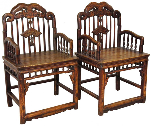Pair of Chinese late Qing cedarwood armchairs. Leslie Hindman Auctioneers image.