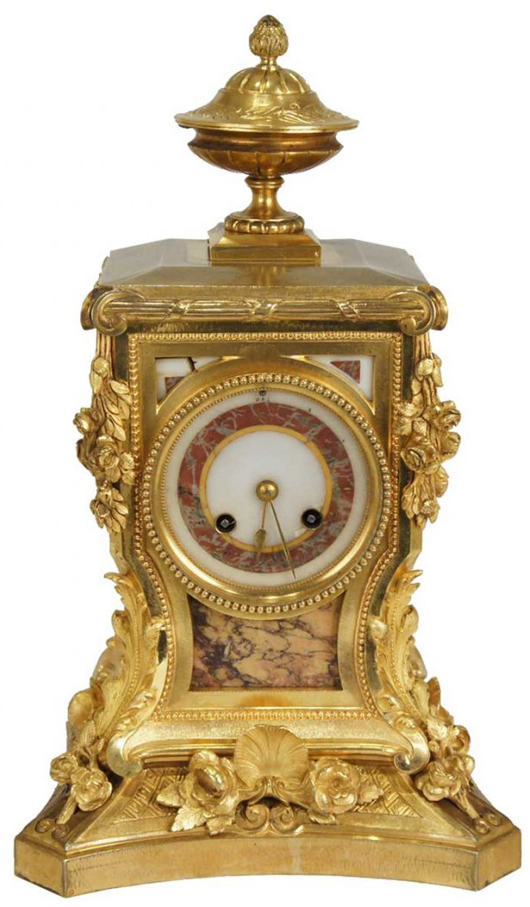 French Napoleon III gilt bronze and rouge marble mantel clock. Leslie Hindman Auctioneers image.