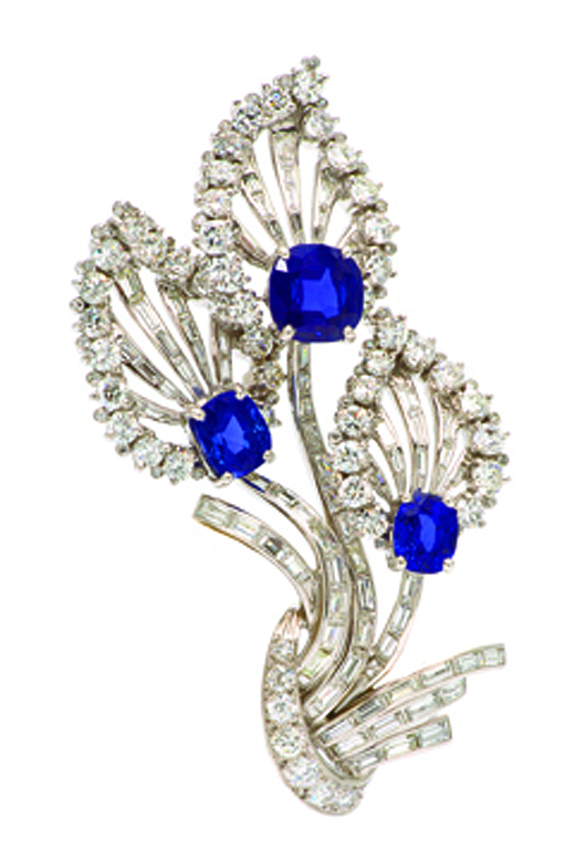 Sapphire and diamond floral brooch by Tiffany & Co. realized: $128,100. Leslie Hindman Auctioneers image.