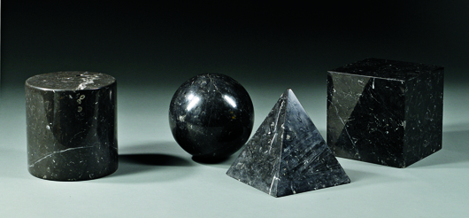 Four geometric sculptures, black stone with white veins, unmarked. Skinner Inc. image.  