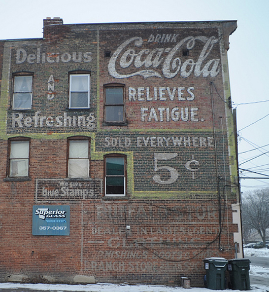 Coca-Cola outdoor mural, or 'ghost sign,' painted by an early 'walldog' in the first quarter of the 20th century in Schenectady, N.Y.  Photo copyright Chuck Miller. All rights reserved.