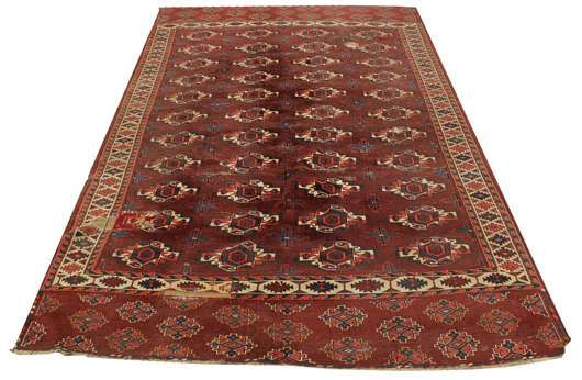 This antique Turkoman carpet, circa 1900, deaccessioned by the Honolulu Museum of Art sold for over 10 times its high estimate at $8,888. Clars Auction Gallery image.