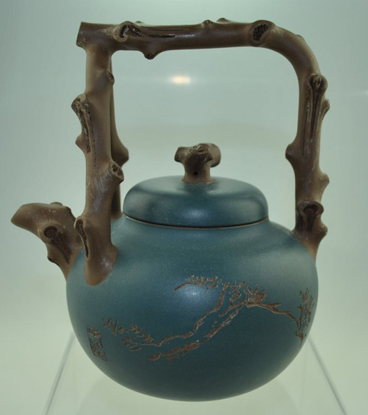 Purple clay teapot from the teaset created to make the centennial anniversary of Chinese painting master Zhu Qizhan. Image courtesy of LiveAuctioneers.com and Five Star Auctions.