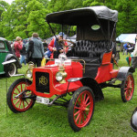 A 1906 REO Runabout. This file is licensed under the Creative Commons Attribution-Share Alike 3.0 Unported license.