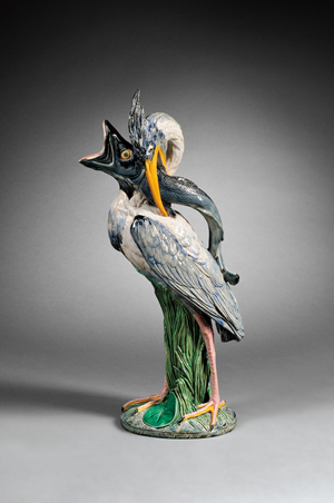 Minton majolica heron and fish ewer, England, date cipher for 1866, modeled and signed by Huges Protat, in the shape of heron with a pike in its beak, 21 1/2 inches high. Estimate: $5,000-$7,000. Skinner Inc. image.