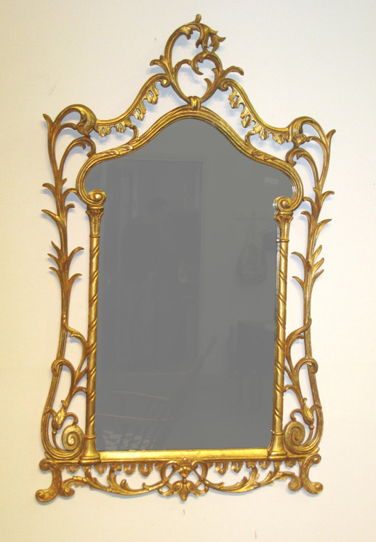 Beautiful carved and gold leaf decorated Baroque style mirror, 45 1/2 inches by 28 inches. Gordon S. Converse & Co. image.