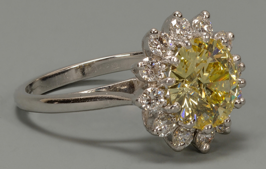 A 2.99 carat fancy yellow diamond and platinum ring, fresh from a Knoxville estate, brought a strong $29,000 (est. $9,500-12,500). Case Antiques image.