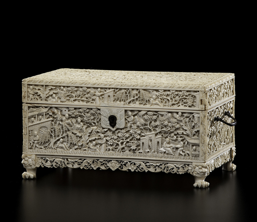 Chinese export ivory sewing box with hinged lid having two handles and a removable fitted interior tray holding carved ivory accessories, all finely carved with a procession of figures in a landscape, a scrolling floral apron, all rising on carved foo lion feet. Estimate: $8,000-$10,000. Cowan's Auctions Inc. image.