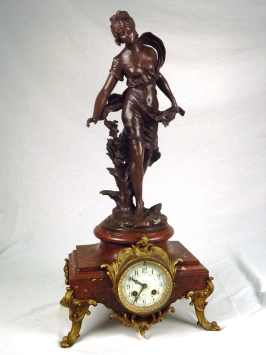 Aug. Moreau bronze statue surmounted on a marble-base clock, marked 'Reims.' Est. $4,000-$5,000. B. Langston's image.