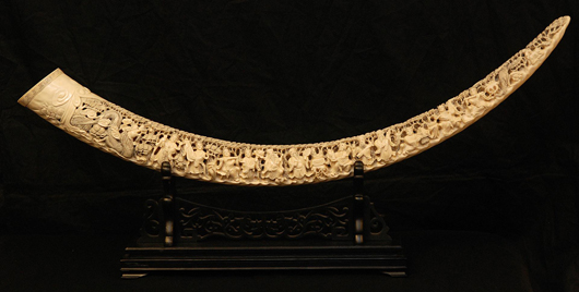Large Chinese Qing Dynasty relief-carved, fully reticulated ivory tusk. 53 1/2 inches in length. Elite Decorative Arts image.
