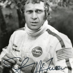 Signed Steve McQueen publicity photo from the 1971 film 'Le Mans.' Sold for $3,690 inclusive of 23% buyer's premium. Image courtesy of LiveAuctioneers.com and Profiles in History.