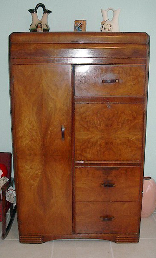 The ultimate combination of the chiffonier, the wardrobe and the secretary is achieved in this chifforobe/secretary which has a drop-front desk installed on the right side. 