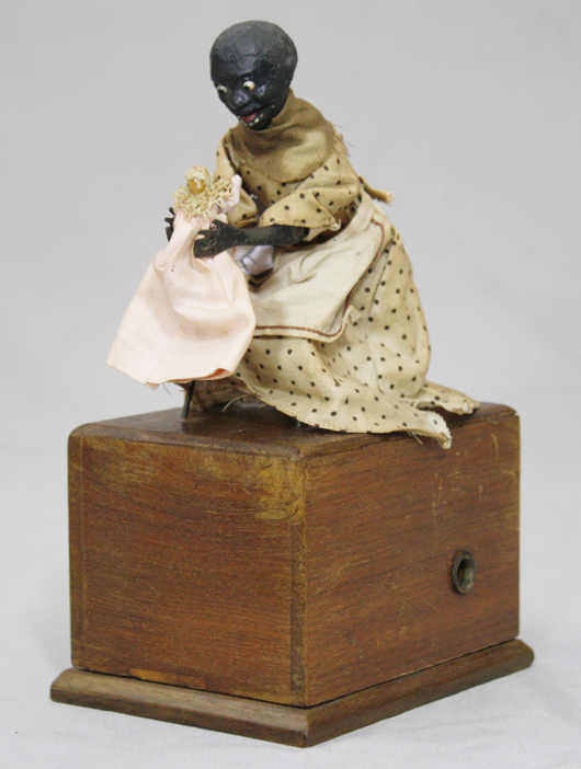 Ives, Blakeslee black Americana toy 'The Nursemaid,' circa 1875, $11,638. RSL Auction Co. image.