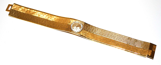 18K gold Universal Geneve ladies wristwatch. Roland Auction image.