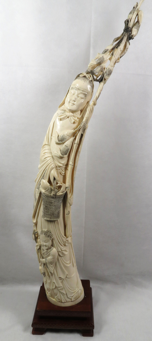 Carved ivory tusk. Carstens Galleries image.