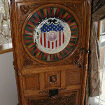 Antique Dewey upright slot machine, est. $52,500-$105,000. Government Auctions image.