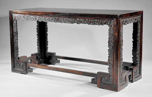 Fine and rare Chinese zitan table, 62 1/4 inches wide x 25 3/4 inches deep. Estimate: $100,000-$150,000. Neal Auction Co. image. 