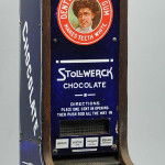 Stollwerck and Chiclets vending machine designed to dispense both chocolate candy and chewing gum; porcelain with wood back, $28,200. Morphy Auctions image.