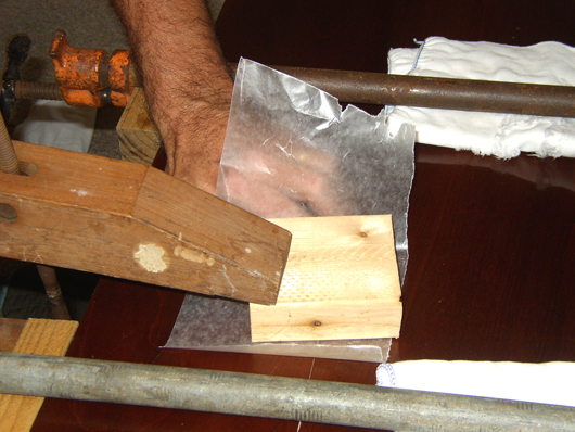 A deep-throated Jorgensen clamp was used in the middle of the table to keep the joint level.