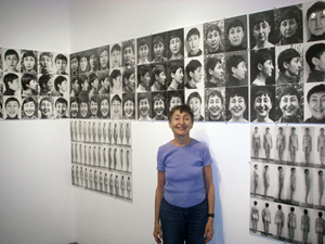 Artist Athena Tacha in front of her conceptual photographic work '36 Years of Aging' (1972-2008). Image courtesy Wikimedia Commons.