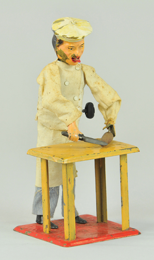 Fernand Martin ‘Little Cook’ wind-up toy, French, est. 2,500-$3,000. Bertoia Auctions image.