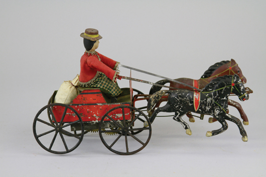 Ives tin Double-Galloper with cloth-dressed driver, est. $3,000-$3,500. Bertoia Auctions image.