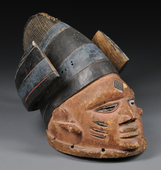 Yoruba carved wood Gelede Society mask, 18 inches high. Estimate: $250-$350. Skinner Inc. image.