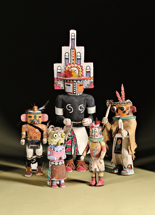 The largest kachina in this group is lot no. 153, a Hopi carved wood hemis kachina by White Bear Fredericks, 19 1/2 inches. Estimate: $500-$700. Skinner Inc. image.