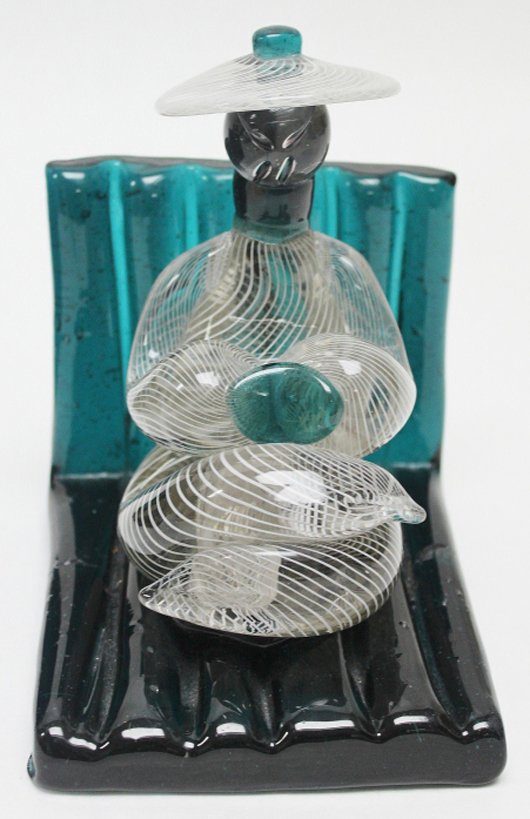 One of two Murano art glass bookends with cooli figures. M.G. Neely Auction Gallery image.