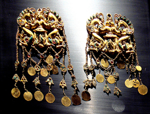 Included in the Bactrian Treasure are earrings from the royal burial Tillia tepe, first century B.C. in Bactria. Image by Musee Guimet. This file is licensed under the Creative Commons Attribution-Share Alike 3.0 Unported license.
