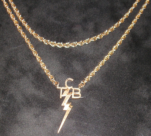 Elvis Presley 14-karat gold TCB pendant chain/necklace designed by Elvis and Beverly Hills jeweler Lee Abeleser of Schwartz and Abeleser’s Fine Jewelry. Estimate: 4,000-66,000 pounds. Omega Auctions image.