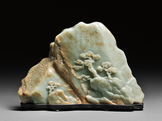Jade boulder mountain, China, 19th century, in the shape of a horizontal mountain range with pine trees carved in relief on both sides, 11 1/8 inches. Estimate: $20,000-$25,000. Skinner Inc. image.