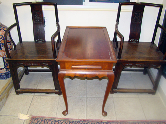 A second pair of huanghuali chairs flank one of several Eldred Wheeler tables to be offered. TAC Auctions image.