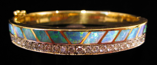 David Freeland opal and diamond bracelet with 1 cttw of stunning diamonds in 18K yellow gold with opal inlay, signed DRF JR, 46.7g. Est. $3,000-$4,000. WatchAuctionHQ image.