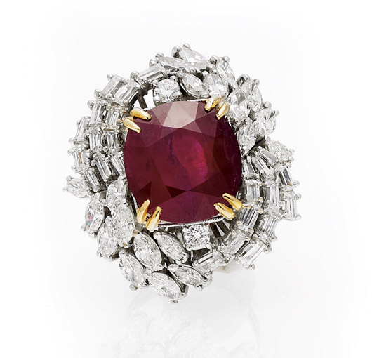 Ladies 18K white gold ring with cushion-cut oval faceted ‘blood-red’ ruby weighing approx. 14.30 carats; surrounding diamonds with total weight of 5 carats. Est. $25,000-$35,000. I.M. Chait image.