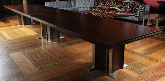 Massive Art Deco mahogany boardroom table. Estimate $10,000-$15,000. Material Culture image.